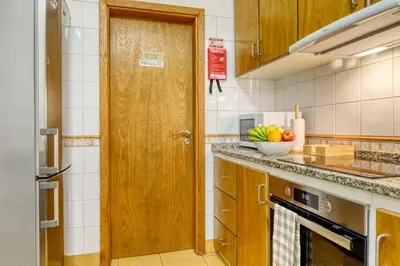 a kitchen with a bowl of fruit on the counter at Alzira's Place, a Home in Madeira in Ponta do Sol