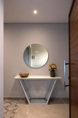 a dressing table with a mirror on a wall at Villa Joy, moderna e sofisticada in Funchal