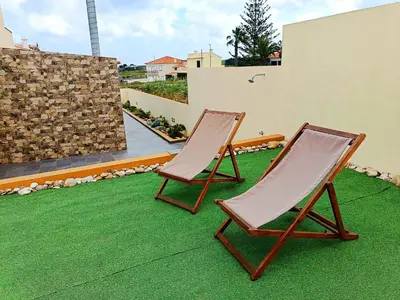 a yellow house on the side of a road at La Maison Dorée in Porto Santo