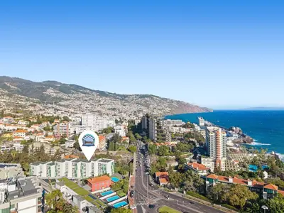 an aerial view of a city and the ocean at Vista Savoy Apartamento in Funchal
