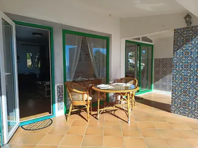 a dining room with a table and chairs at Private Oceanfront Cottage with 180 degree Sea View, 100 m Terrace in Funchal