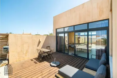 a wooden deck in front of a house at Good Times Sagres in Sagres