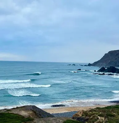 a beach with the ocean in the background at Good Times Sagres in Sagres