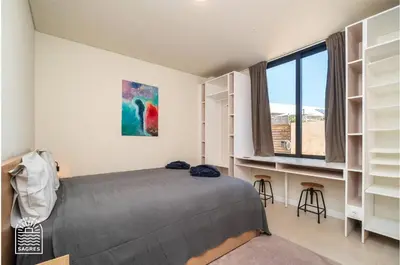 a bedroom with a bed and a painting on the wall at Good Times Sagres in Sagres