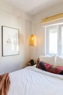 a bedroom with a white bed and a lamp at Casa Phoebe - NEW Renovated Burgau Apartment Sleeps 5 - Beach 1 min in Burgau