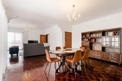 a dining room with a table and chairs at Villa do Carmo by GALMI in Funchal