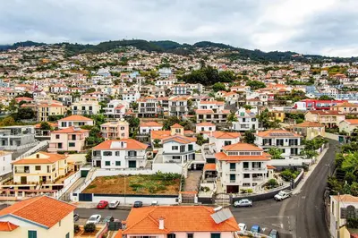 a view of a city with houses on a hill at Villa do Carmo by GALMI in Funchal