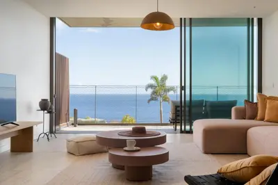 a living room with a view of the ocean at Savoy Monumentalis VII by An Island Apart in Funchal