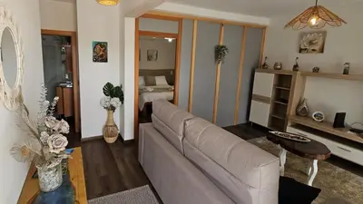 a living room with a couch and a table at Lower Floor In Flor do Campo - Santana in Santana