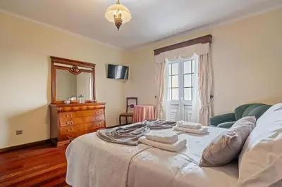 a bedroom with a bed with two towels on it at Ocean Hill View By Zest&Guest in Câmara de Lobos