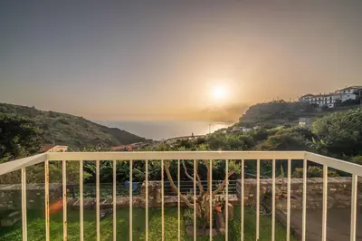 a view of the ocean from the balcony of a house at João Loft II by Mth in Campanário