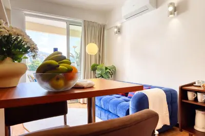 a living room with a bowl of fruit on a table at Aida's Place, a Home in Madeira in Funchal