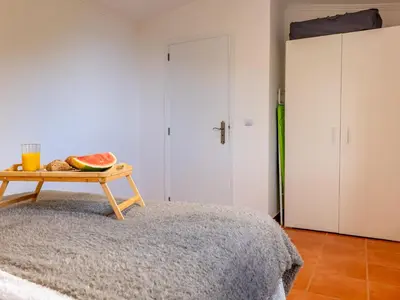 a room with a table with a bowl of fruit on a table at Vista do Vale, By OP in São Vicente