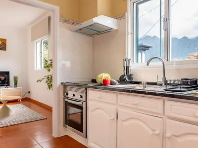 a kitchen with a sink and a window at Vista do Vale, By OP in São Vicente