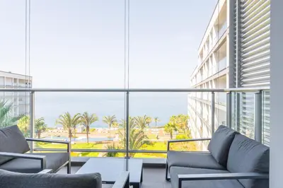 a view of the ocean from the balcony of a building at FLH Oceanfront Luxury at Madeira Palace Residence in Funchal
