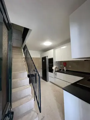a kitchen with a staircase leading to a kitchenasteryasteryasteryasteryasteryasteryastery at Casinha da Montanha - Paraíso 7 in Ribeira Brava