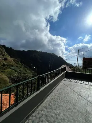 a balcony with a view of a mountain at Casinha da Montanha - Paraíso 7 in Ribeira Brava