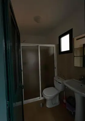 a bathroom with a toilet and a sink at Casinha da Montanha - Paraíso 7 in Ribeira Brava