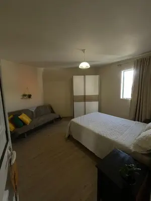 a bedroom with two beds and a window at Casinha da Montanha - Paraíso 7 in Ribeira Brava