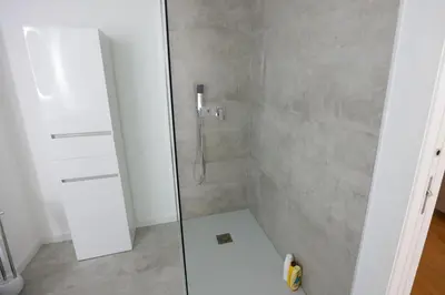 a shower with a glass door in a bathroom at Luxury LeilaMar Apartment - Modern Retreat in Funchal