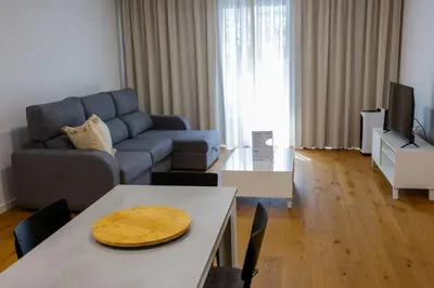 a living room with a couch and a table at Luxury LeilaMar Apartment - Modern Retreat in Funchal