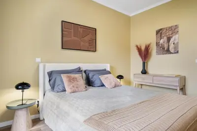 a bedroom with a bed with two pillows at SUPER Coral in Funchal