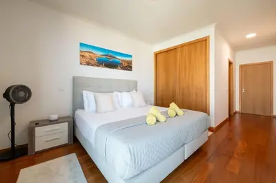 a bathroom with a tub and a sink at Nomad Escape Spacious Apartment with Pool & Gym in Funchal