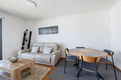 a playground in a city with red swings at Nomad Escape Spacious Apartment with Pool & Gym in Funchal