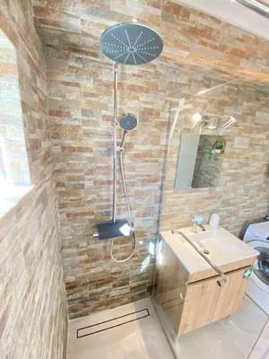 a bathroom with a shower and a sink at Casa do Sol in Sagres
