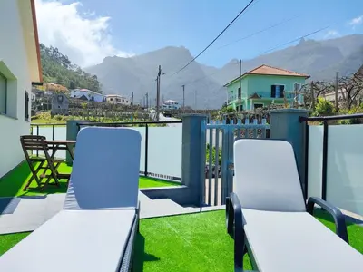 a view of a valley with mountains in the background at Hillslope House in São Vicente
