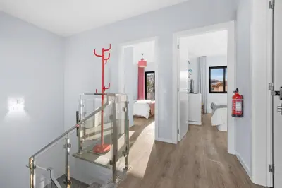 a room with a staircase and a room with a bedroom at Mimi Holiday House - Free Parking in Funchal