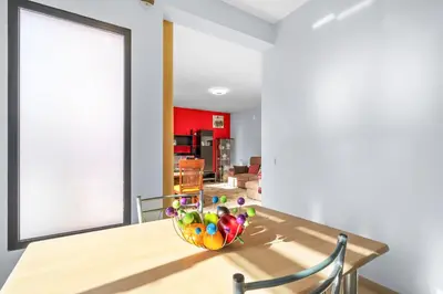 a dining room with a table with a bowl of eggs on it at Mimi Holiday House - Free Parking in Funchal