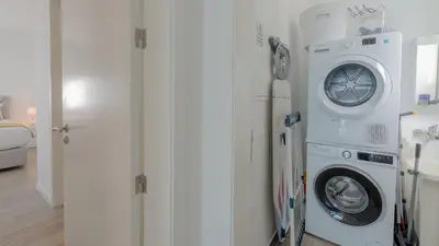 a white washer and dryer in a room at Moonlight Villa by LovelyStay in Estreito da Calheta