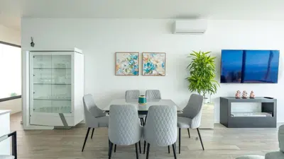 a dining room with a table and chairs at Moonlight Villa by LovelyStay in Estreito da Calheta