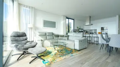 a living room with a couch and chairs and a table at Moonlight Villa by LovelyStay in Estreito da Calheta
