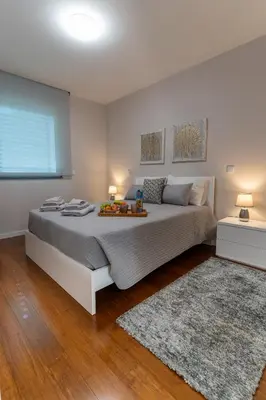 a bedroom with a large bed and a window at Alameda Formosa Varanda Zona Turística Funchal in Funchal