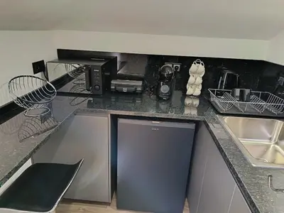a kitchen with a sink and a counter top at Rose house in Ribeira Brava