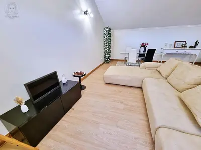 a living room with a couch and a flat screen tv at Dª Xica Holidays in Santa Cruz
