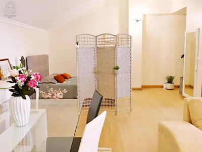 a living room with a couch and a table at Dª Xica Holidays in Santa Cruz