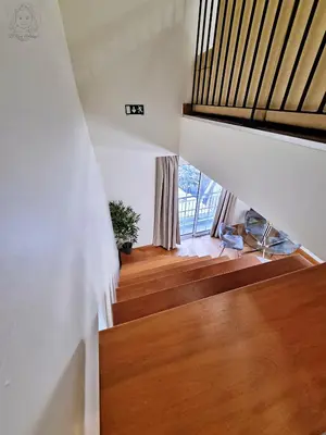 a staircase in a house with wooden floors and a window at Dª Xica Holidays in Santa Cruz