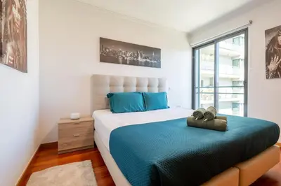 a swimming pool in the middle of a building at Nomad Horizon Spacious Apartment with Pool & Gym in Funchal