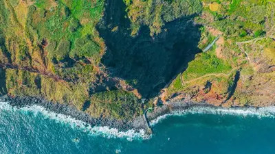 an aerial view of the ocean and a mountain at Sonhos na Iha III by Holiday Rental Madeira in Campanário