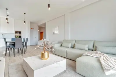 a living room with a couch and a table at Sonhos na Iha III by Holiday Rental Madeira in Campanário