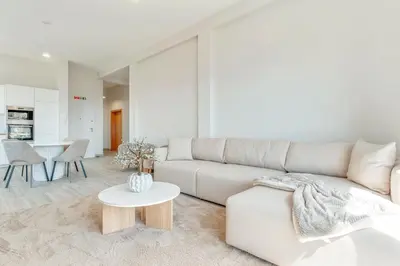 a living room with a white table and chairs at Alegria Residencial II by Holiday Rental Madeira in Campanário
