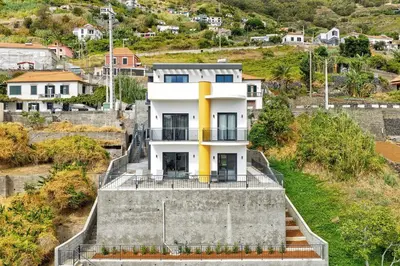 an aerial view of a town next to the ocean at Alegria Residencial II by Holiday Rental Madeira in Campanário