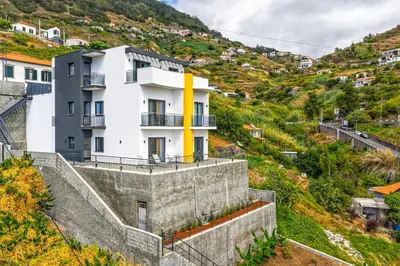 an aerial view of a beach next to the ocean at Alegria Residencial II by Holiday Rental Madeira in Campanário