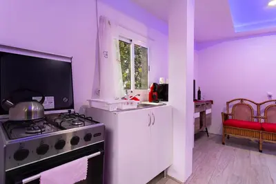 a table with a towel and a roll of toilet paper on it at Luci's House B in São Jorge