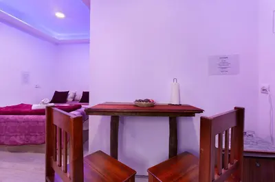 a kitchen with a sink and a shelf with dishes at Luci's House B in São Jorge