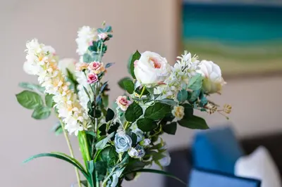 a vase filled with white and pink flowers at GuestReady - Relaxing escape with pool in Funchal