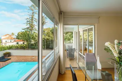 a house with a swimming pool and a balcony at GuestReady - Relaxing escape with pool in Funchal